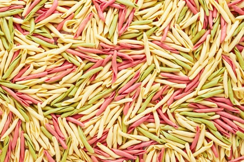 Preview: Food background. Colorful short twisted pasta from Liguria