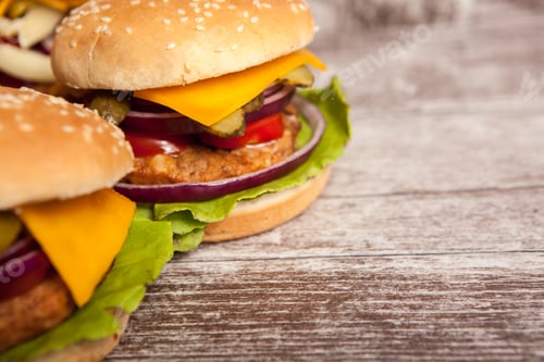 Preview: Delicious tasty burgers on wooden background