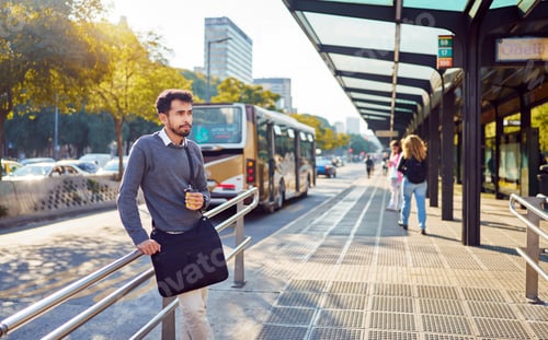 Preview: latin american commuter standing drinking coffee