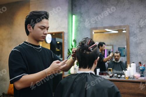 Preview: Barber Cutting Hair of Client