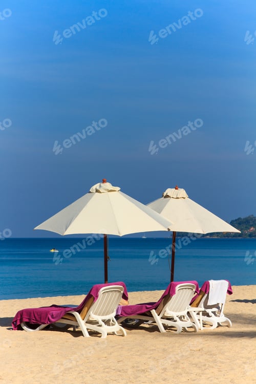 Preview: Sunbeds and umbrella on the beach