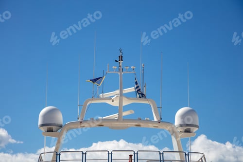 Preview: Yacht rooftop, satellite radar, antennas background marina Flisvou, Greece.