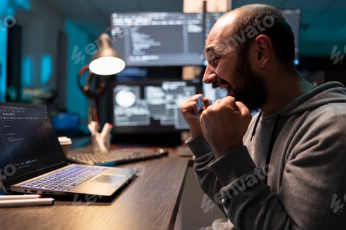Preview: Excited developer raises fists in celebration after fixing critical coding task