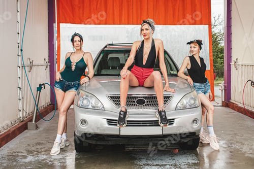 Preview: Three beautiful hot girls pose next to the car