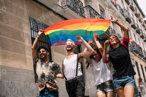 Preview: Group of friends with a flag of gay pride in the city of Madrid
