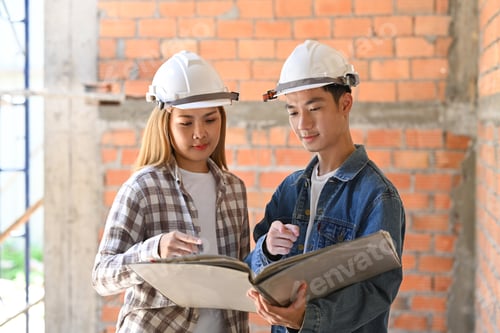 Preview: Civil engineer and woman architect working and discussing on plan at construction site.