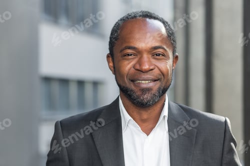 Preview: African american businessman close up, mature man smiling and looking at camera, senior boss in
