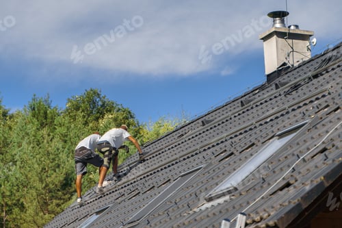 Preview: Men worker installing solar photovoltaic panels on roof, alternative energy, saving resources and