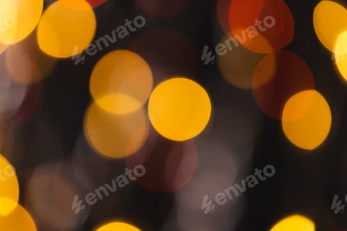 Preview: Multi coloured bokeh lights with copy space on dark background