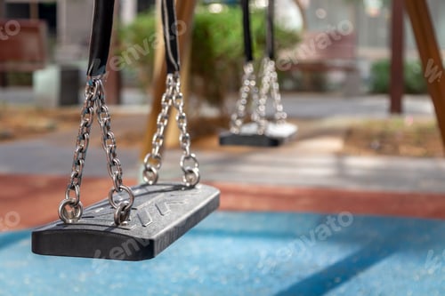 Preview: Empty swings on modern playground outdoors