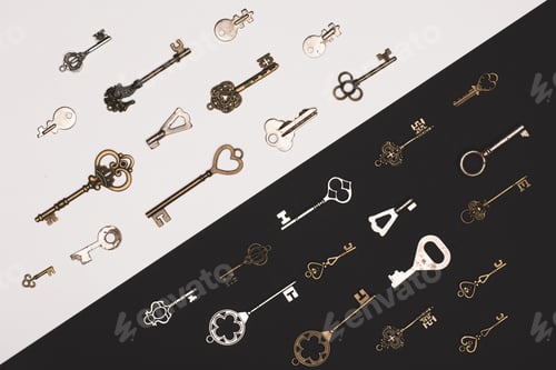 Preview: top view of different vintage keys over black and white background