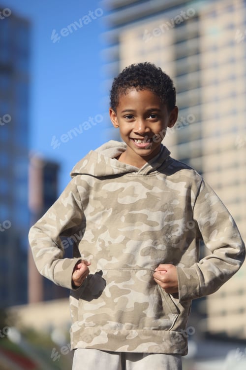 Preview: African American boy playing on the street on a sunny day