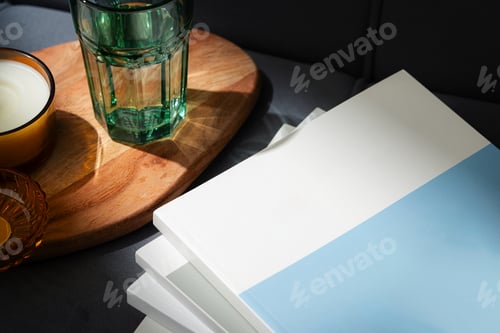 Preview: Amber Glass Candle Jar and Magazine on the couch