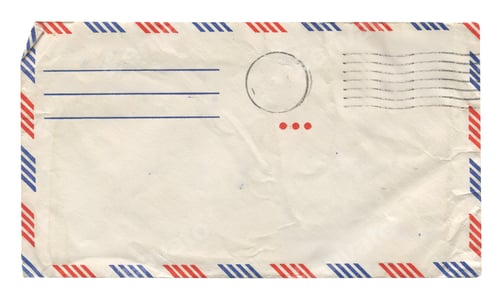 Preview: back view of old closed aged airmail DL envelope with faded stamp isolated on white