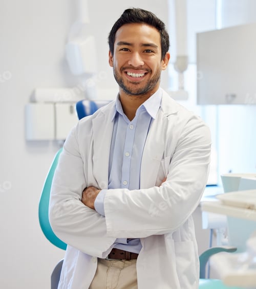 Preview: Portrait of confident a young dentist working in his consulting room