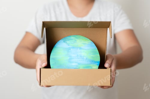 Preview: The world in the paper box. Concept of using recycle paper box to save the planet.
