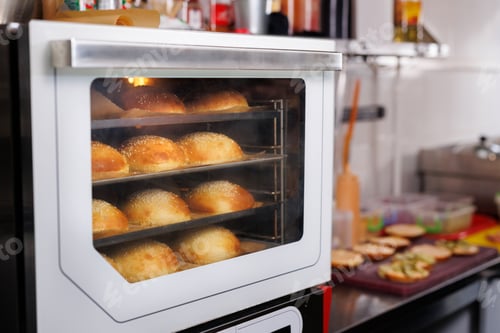 Preview: Burger buns are baked in the oven in the restaurant kitchen.