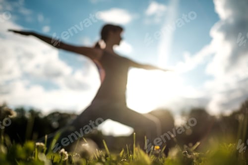 Preview: Woman Practicing Yoga Outdoors on a Sunny Day