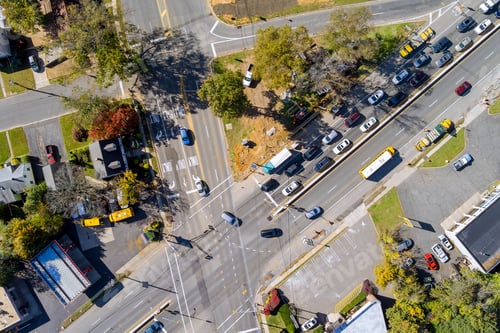 Preview: New Jersey, USA, aerial view of a beautiful small American town near an active road with cars