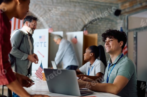Preview: Happy volunteer assisting voters during elections at polling station.