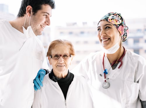 Preview: Friendly Caregivers With a Senior Woman in Hospital