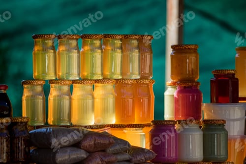 Preview: Close up of pots with different sorts of honey