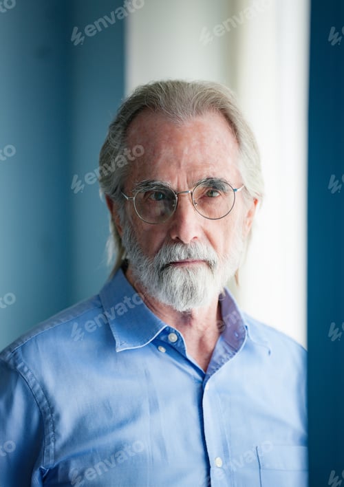 Preview: Portrait of pensive senior man at home