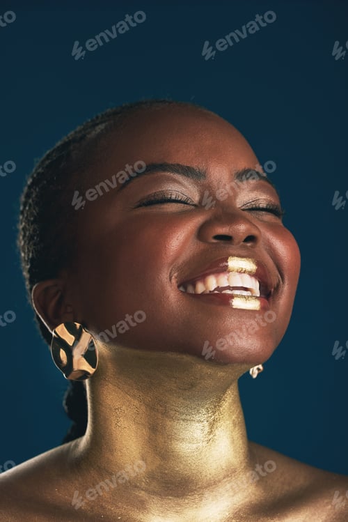 Preview: Gold makeup, face and black woman laughing at funny creativity, facial cosmetics paint and beauty a