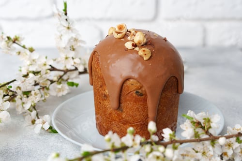 Preview: Ester cake with chocolate topping and nuts on gray background