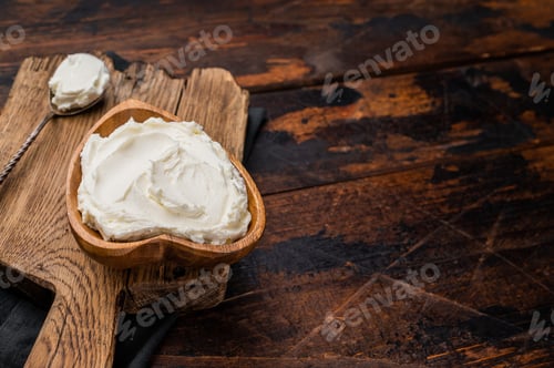 Preview: Traditional Mascarpone cheese in wooden bowl. wooden background. top view
