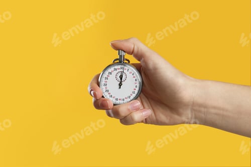 Preview: Woman holding vintage timer on yellow background, closeup