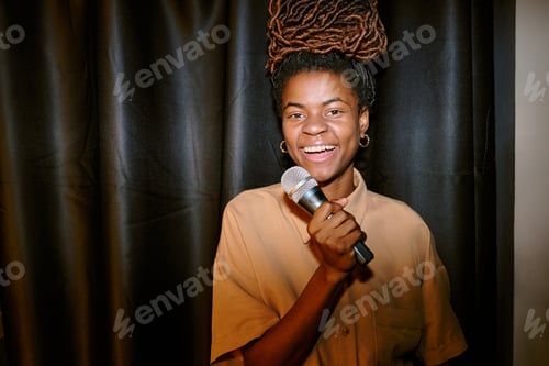 Preview: Portrait of Smiling Woman Holding Microphone