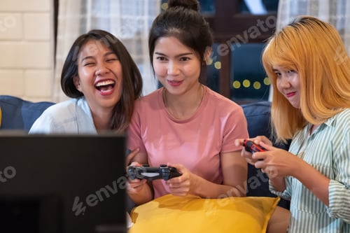 Preview: Three Young Women Play Video Games at Home