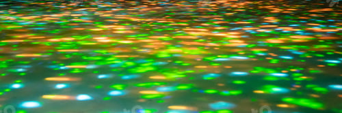 Preview: blurred rays of light on the disco floor. red green blue neon searchlight lights. laser lines and li