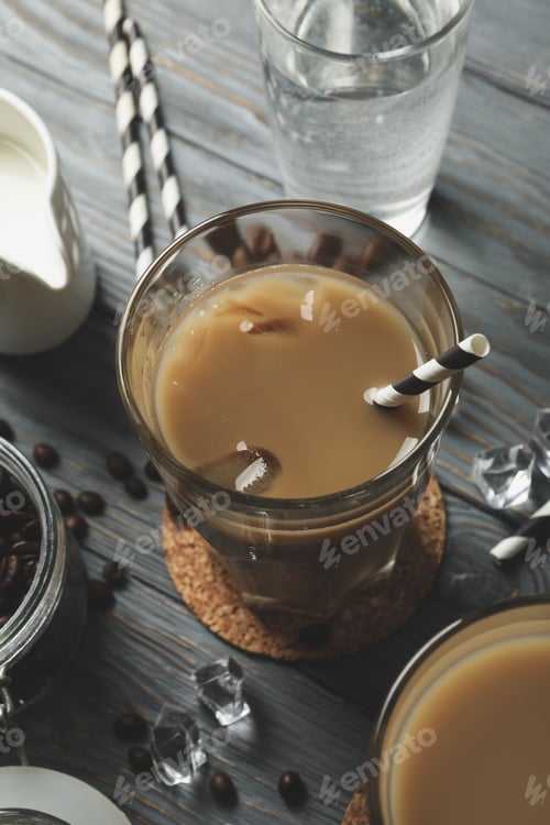 Preview: Composition with glasses of ice coffee on wooden background