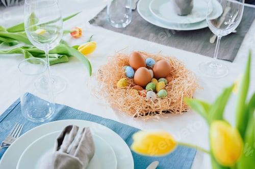Preview: Beautiful Easter table setting with festive decor indoors.