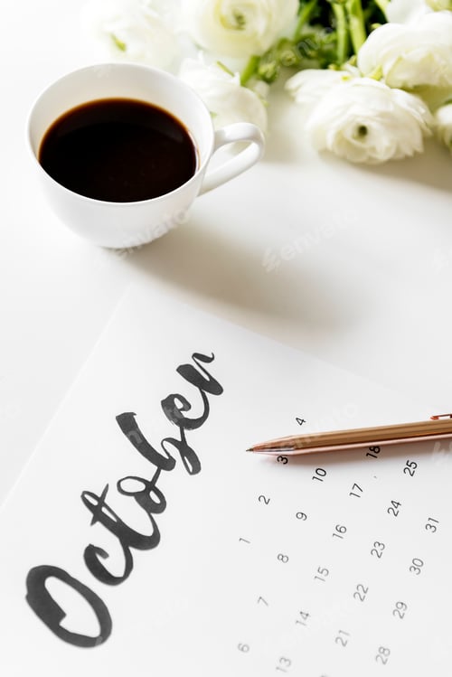 Preview: Aerial view of calendar with coffee cup