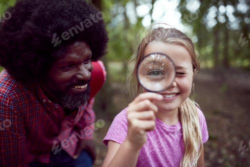 Preview: Girl With Male Team Leader At Outdoor Activity Camp Studying Forest Nature With Magnifying Glass