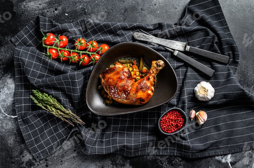 Preview: Cooked roasted chicken legs. Grilled meat. Blacked background. Top view