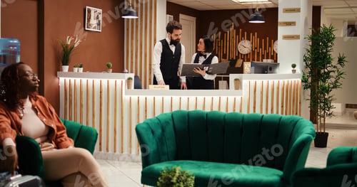 Preview: Hotel manager discussing room upgrade