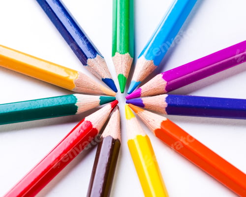 Preview: Colorful arrangement of colored pencils creating a vibrant display of art supplies on a white