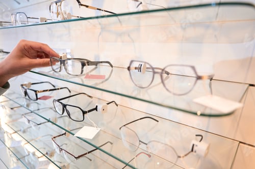 Preview: Unrecognized person is looking for the eye glasses for the gift in the store