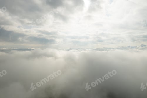 Preview: Panoramic view of beautiful blue sky with clouds and sun lights. View above clouds