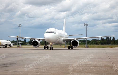 Preview: Passanger white plane lands. Blue airplane on the platform of Airport. Runway. Landing aircraft