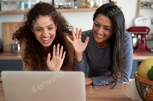 Preview: Happy woman waving to someone during a video conference
