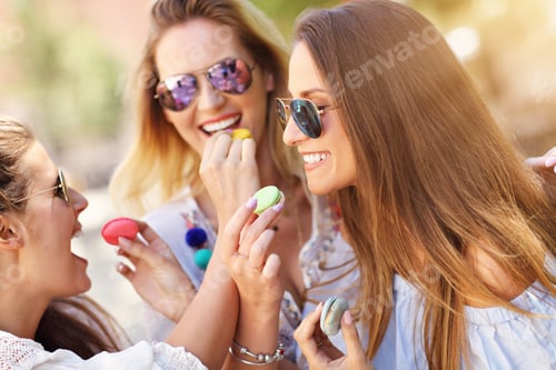 Preview: Happy girl friends hanging out in the city in summer