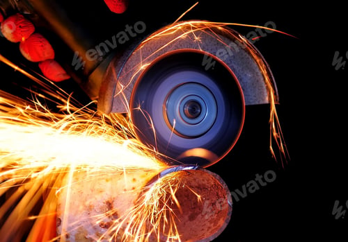 Preview: Worker cutting metal with grinder