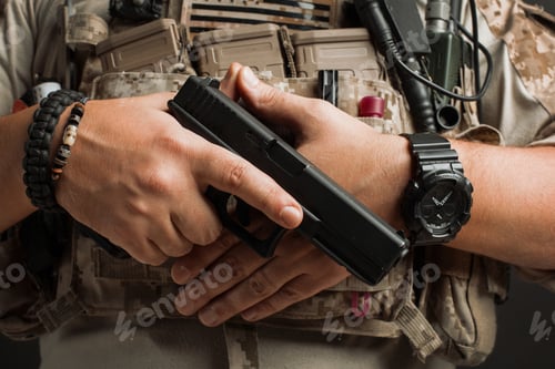 Preview: Close-up of a man holding a gun.