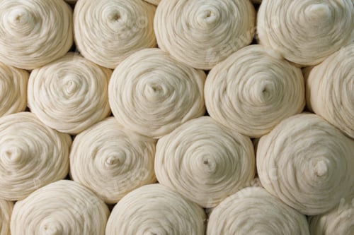 Preview: Merino wool yarn rolls texture background for textile manufacturing industry