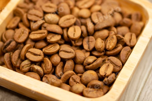 Preview: roasted coffee beans in wooden plate
